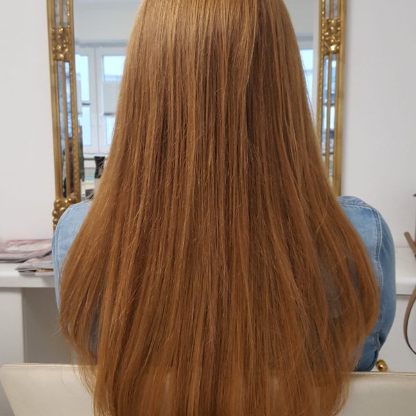 Rote Haare nach einer Haarverdichtung mit Echthaar tressen