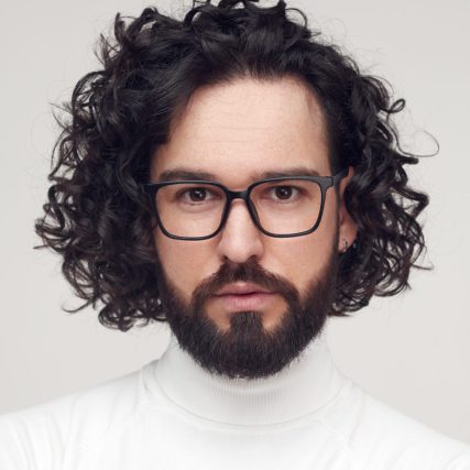 man with long brown dark hair